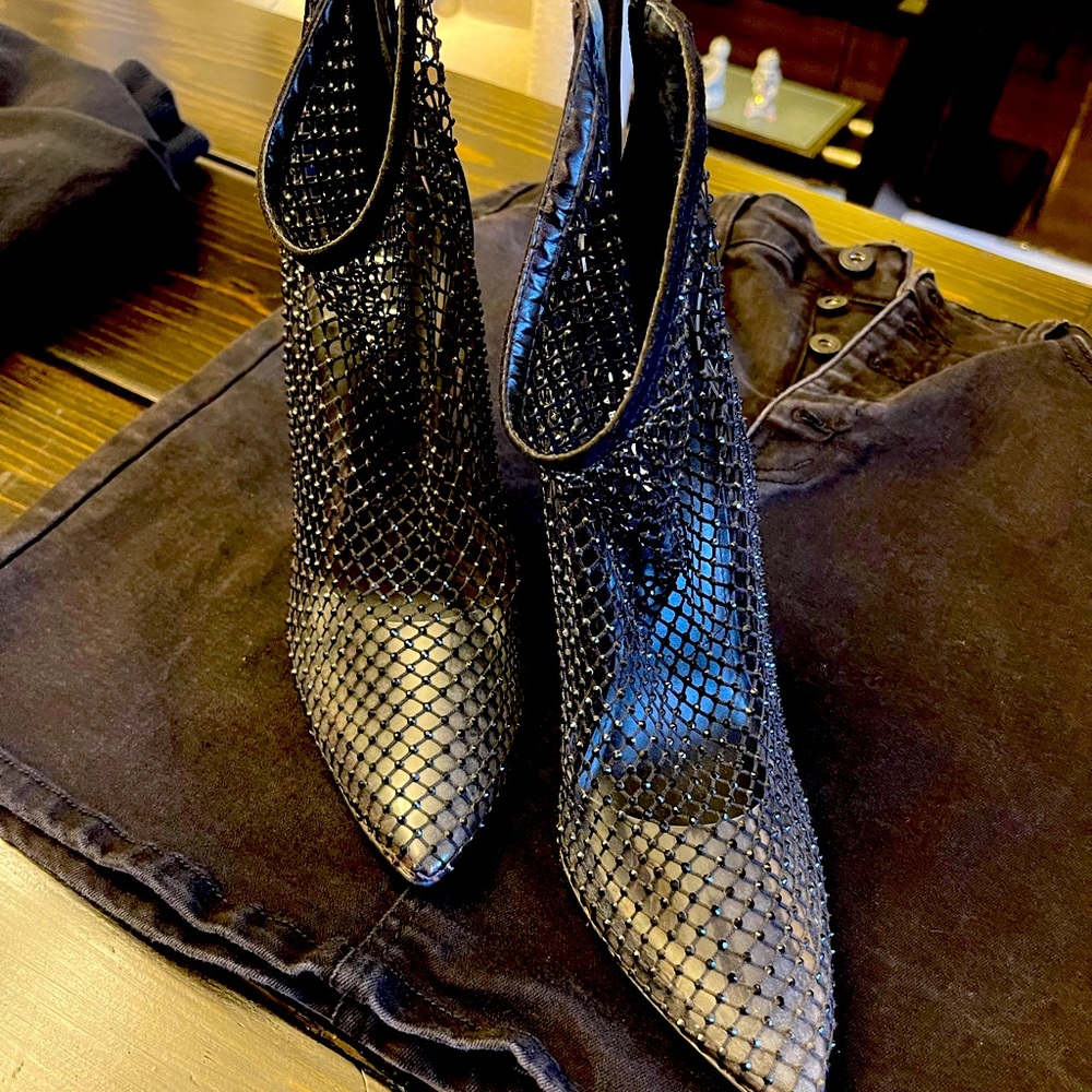 Sexy booties. Looks great with jeans or dress. Only worn once.